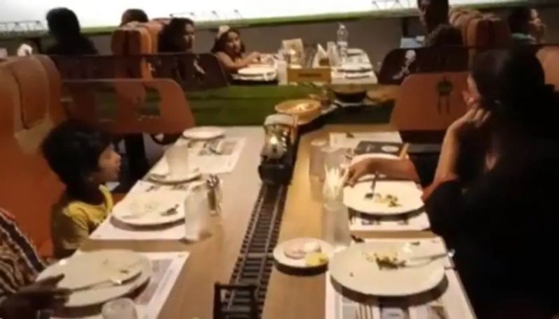 Restaurant Serves Food on Toy Train