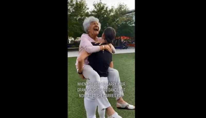 woman carrying grandma and dances