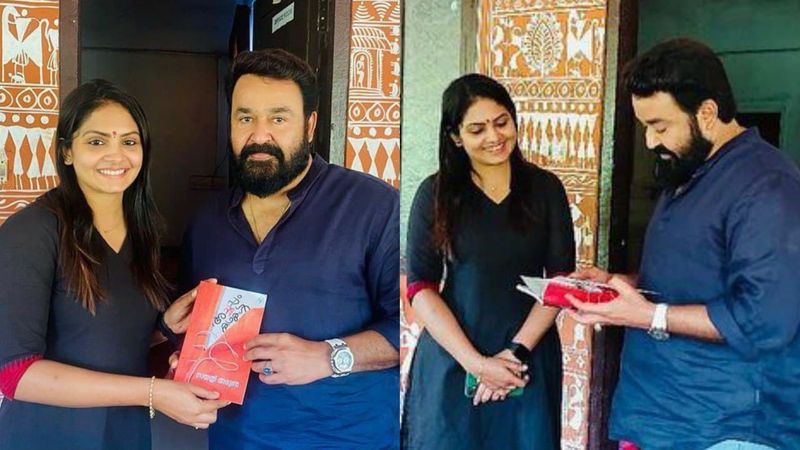 actress gayathri arun handover her latest published book achappam kathakal to actor mohanlal