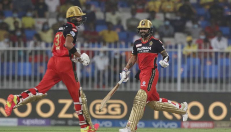 IPL 2021 RCB vs CSK Watch Virat Kohli sends ball out of Sharjah stadium with a no look six