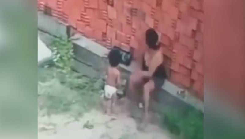 mom protecting child from collapsing wall