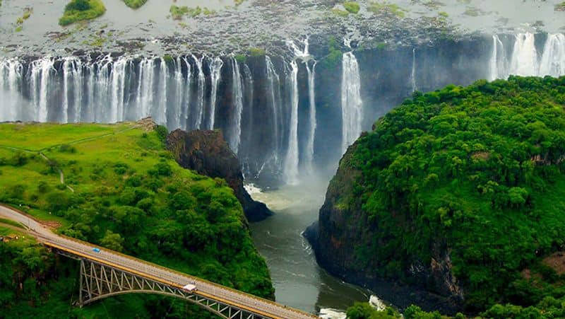 Woman Leans 360 feet tall Victoria Falls in breathtaking viral video