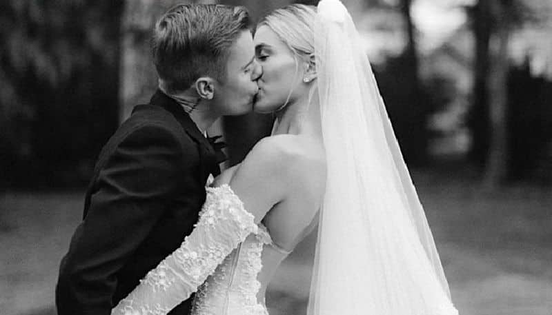 justin bieber and wife shares kissing photos on wedding anniversary