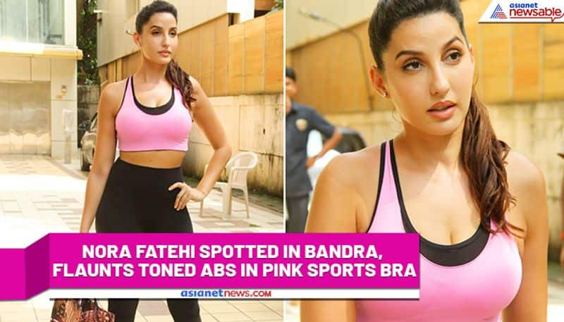 nora fatehi spotted in bandra flaunts toned abs in pink sports bra watch