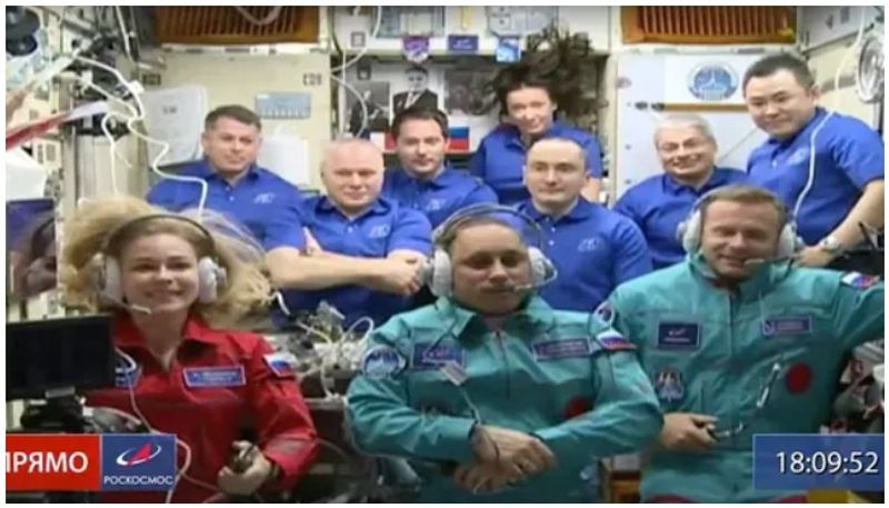 Russian crew arrive at International Space Station to shoot first film in orbit