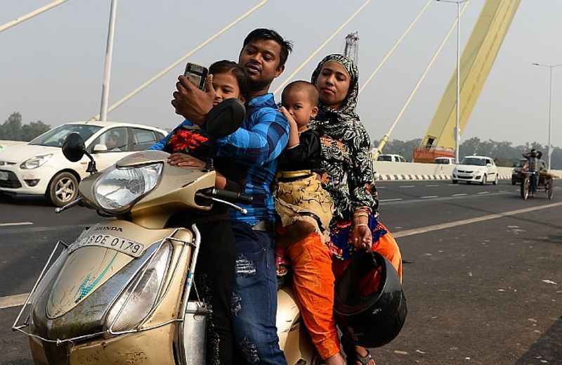 Govt makes safety harness helmet mandatory for children riding pillion on two wheelers gcw