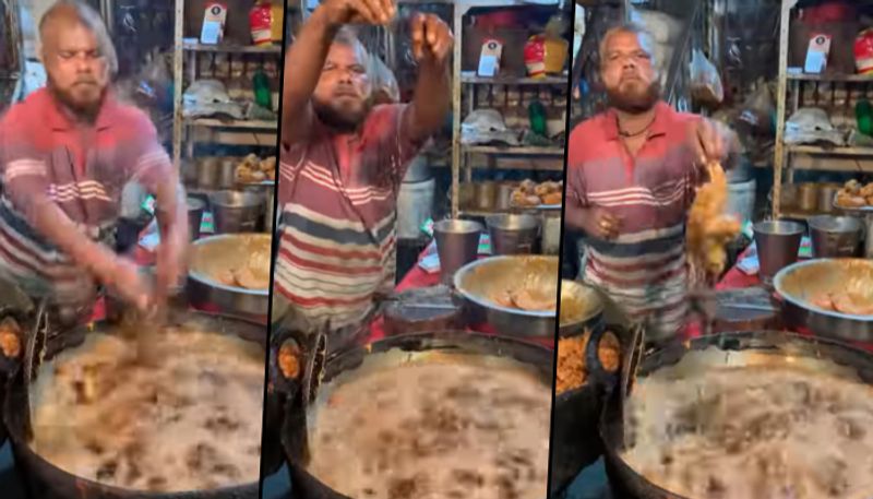 Street vendor dipping his hands in hot oil to fry chicken (Viral Video) - gps