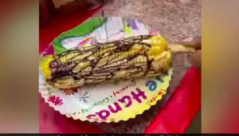 street vendor prepared chocolate masala sweet corn