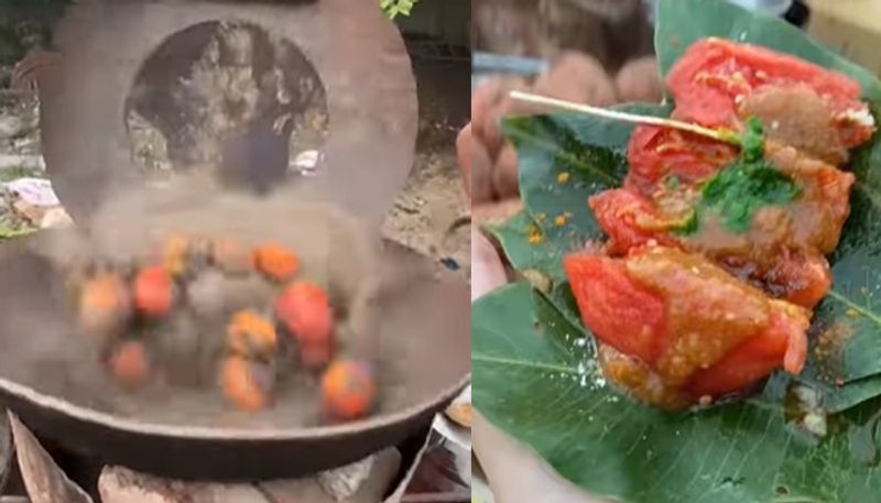 street food vendor roasts tomato in hot sand