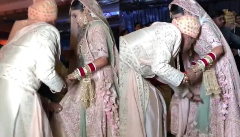 groom helps bride struggling with her lehenga in viral video