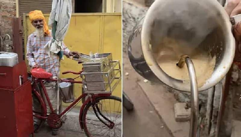 street vendor makes coffee by using cooker