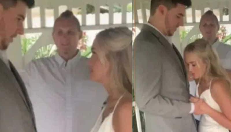 Bride faints on groom during wedding ceremony