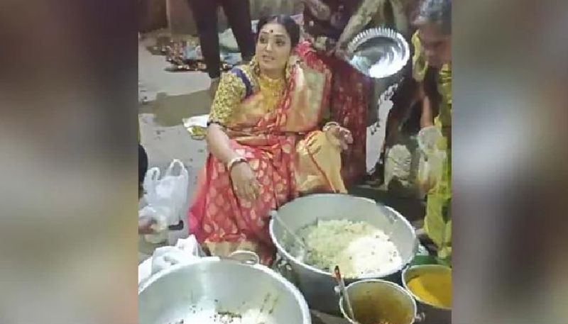 woman distributes food for homeless people after her brothers wedding reception