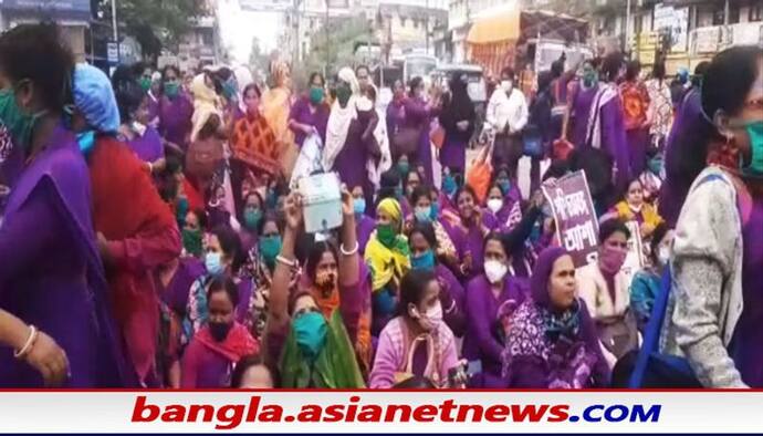 Asha Workers: ১৬ দফা দাবিকে সামনে রেখে জেলায় জেলায় বিক্ষোভ, নতুন বছরে বড় আন্দোলনের ডাক আশা কর্মীদের