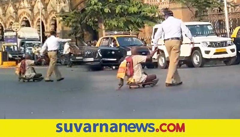 Internet Salutes Mumbai Traffic Cop for Helping Specially abled Man Cross Busy Road akb