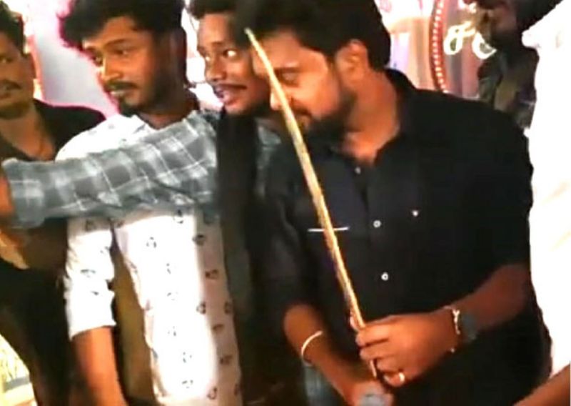 Vijay makkal iyakkam executive and vijay fans cutting a birthday cake with a sword in Madurai is currently going viral on social media