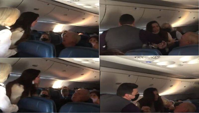 woman punches, spits on another passenger on delta flight arrested video goes viral