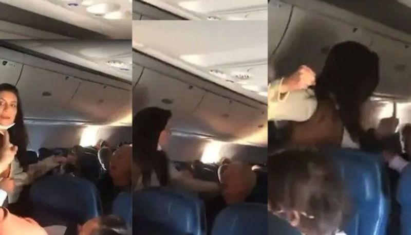 Woman arrested for assaulting elderly man on flight eating without mask