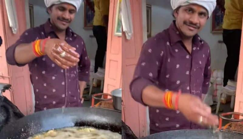 street food vendor dips his hand in boiling hot oil while making pakoda in viral video