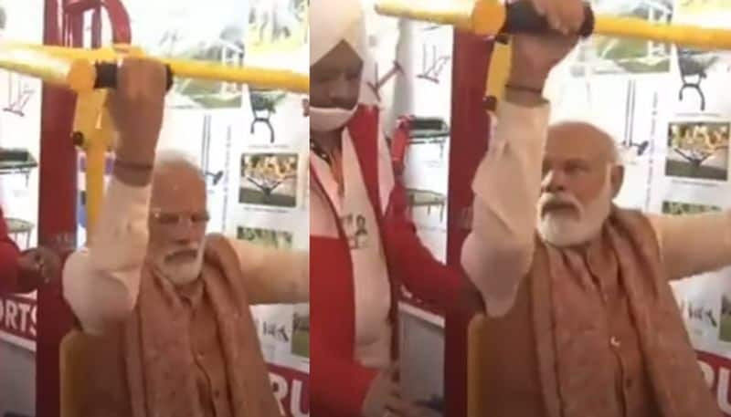 PM Modi attempts weightlifting while inspecting Major Dhyan Chand University