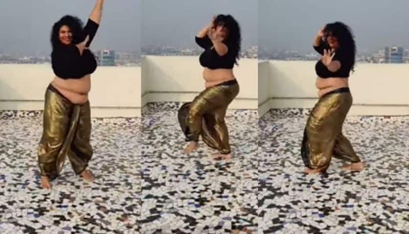 woman reaction on body shaming by doing belly dance