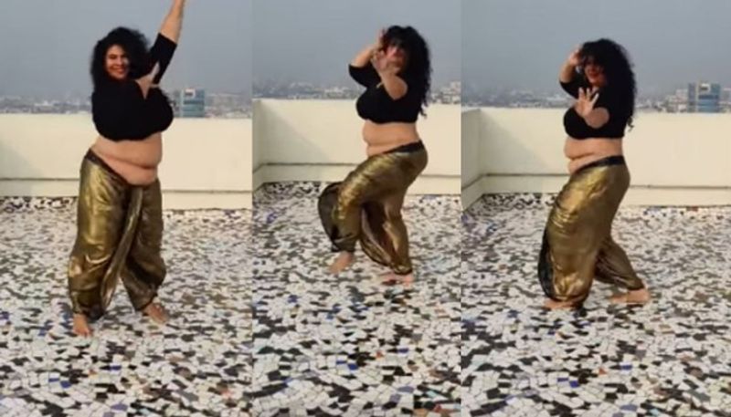 woman reaction on body shaming by doing belly dance