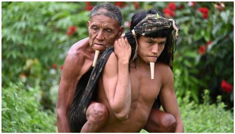 Photo of indigenous man carrying father on his back to vaccine centre goes viral