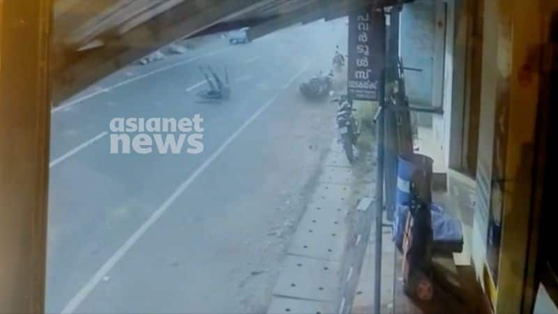 Bike stunt turns tragic in Kollam Youth suffers severe injuries shocking cctv visuals