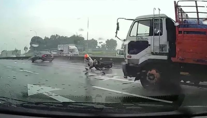 Motorcyclist Crashes In Front Of Approaching Truck