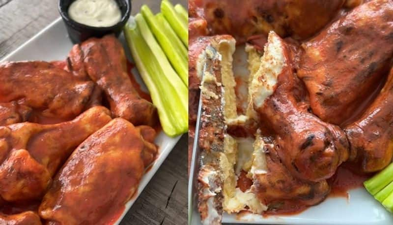 wife gives husband a cake which looks like chicken wings