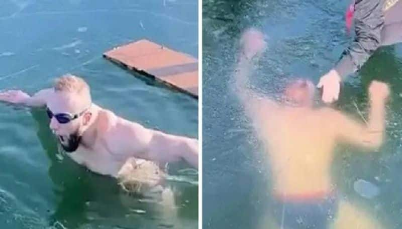 Man swims under frozen lake and trapped video