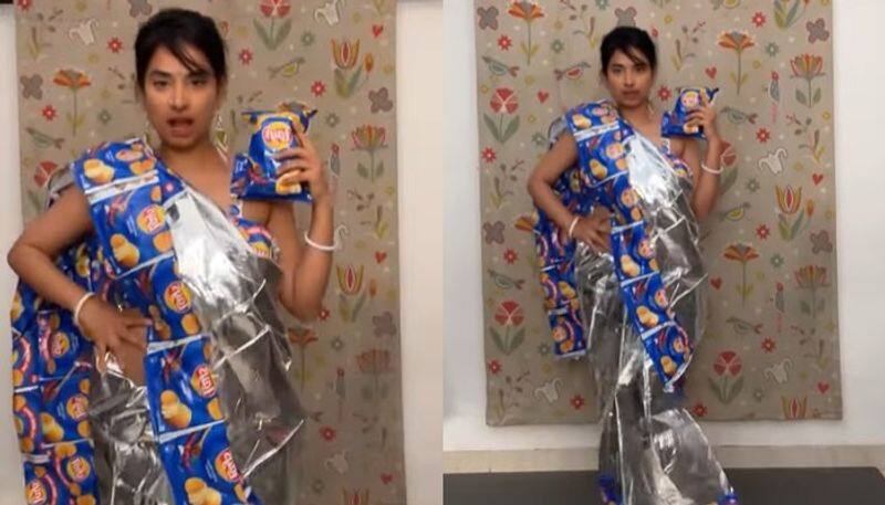 woman made saree by using chips packet