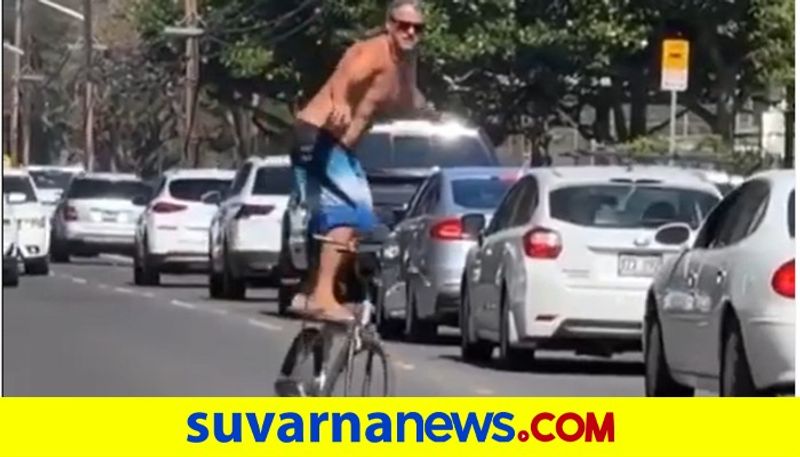 Man Pulls Off Cool Bicycle Stunt in Middle of The Road watch video akb