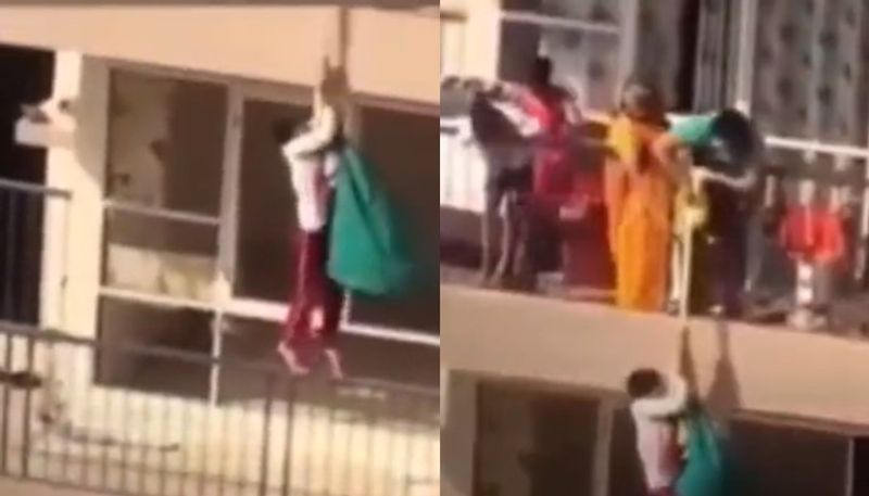 mother hangs son in bedsheet from 10th floor to pick up saree