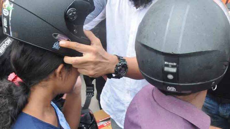 Helmets are mandatory for rear seat occupants... chennai traffic police