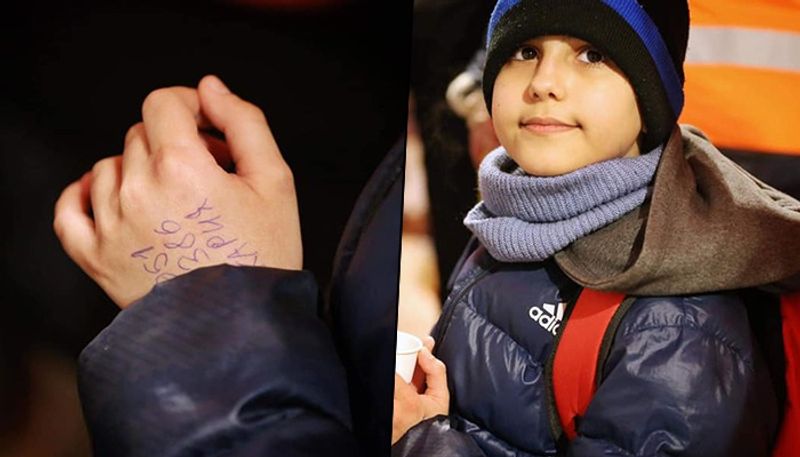 11 year old boy crosses Ukraine border alone with backpack phone number scribbled on his hand gcw