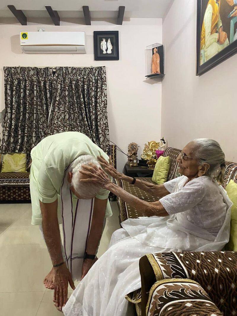 prime minister narendra modi who is on a two day visit to gujarat met his mother heeraben modi at her residence san