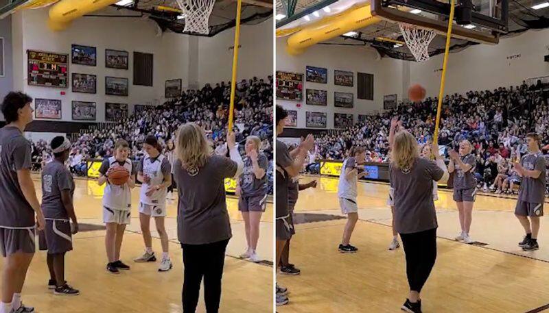 Watch Silent crowd erupts with joy after visually impaired student scores in basketball game-tgy