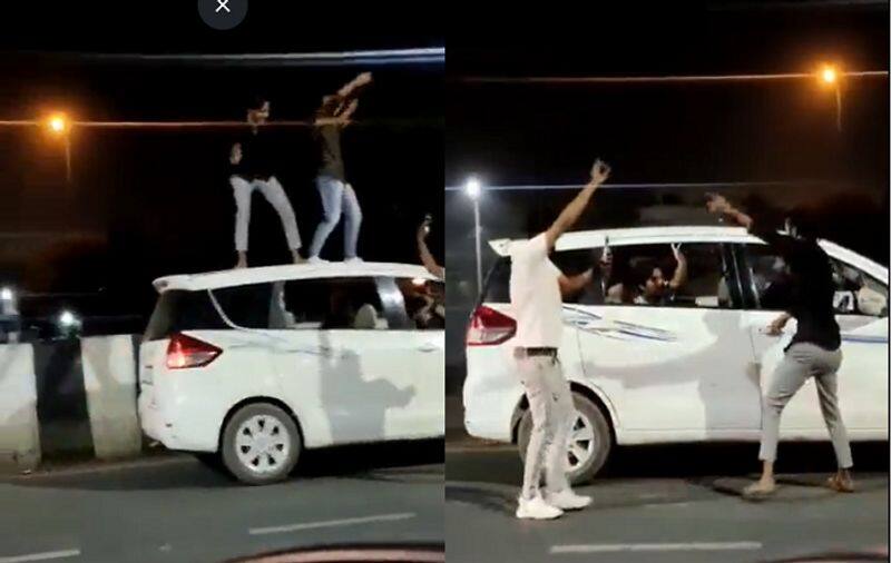 Ghaziabad youths visibly drunk dancing on roof of car Traffic Police fined owner rs 20 000 ckm 