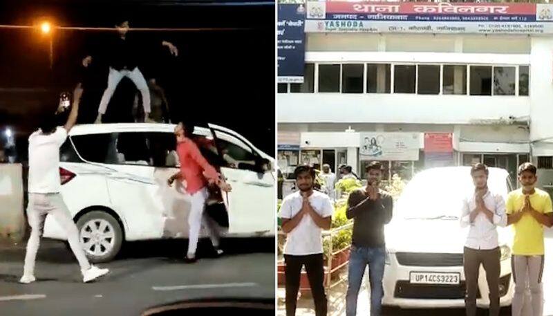 Watch Drunk youth dancing on moving car roof end up paying a Rs 20,000 fine-tgy