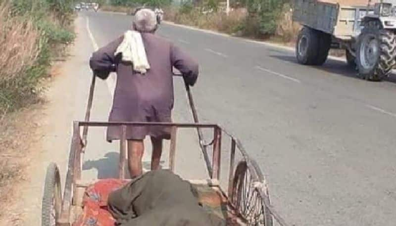 viral photo in which old man takes his wife to hospital in cart