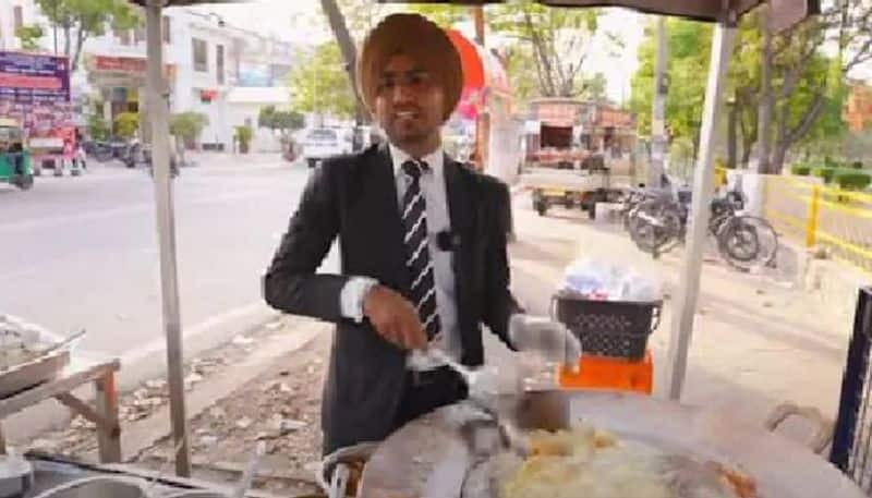 youth runs street food stall with professional look