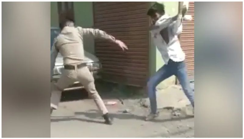 Man Snatches Cop's Baton And Thrashes Him