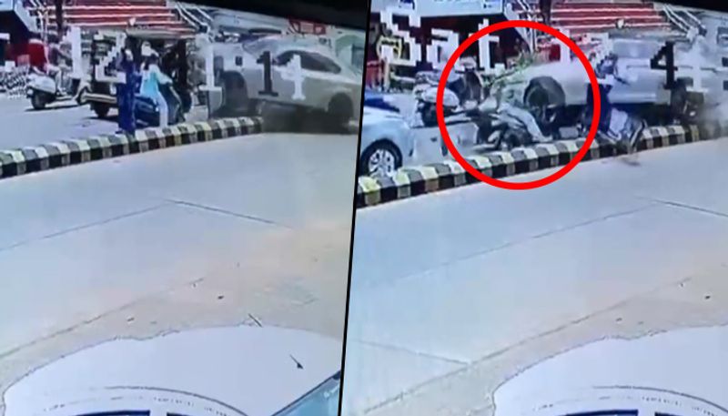 BMW car jumps divider, rams the scooty and injures woman; watch horrifying video - gps