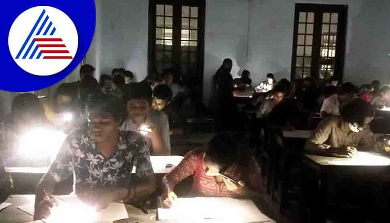 In Kerala government run Maharajas College Students write exam using mobile flashlights san