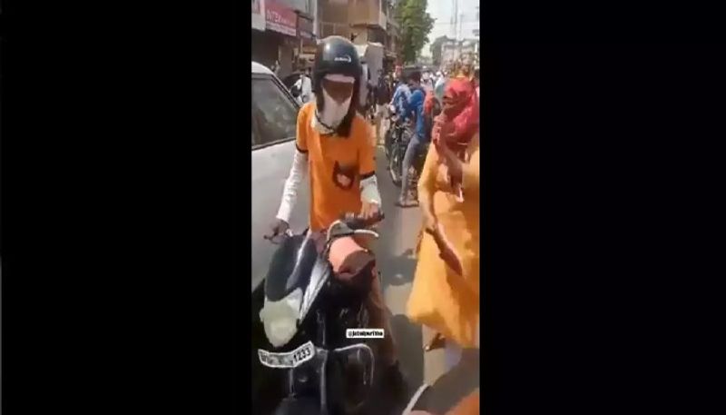 Woman thrashes food delivery boy with shoe  after he hits her scooter 