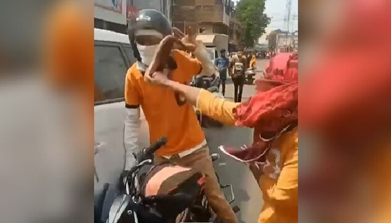 woman beats man with her shoe after bike accident