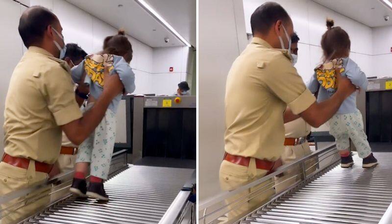 Watch CISF personnel playing with a kid at Delhi airport; netizens love it-tgy