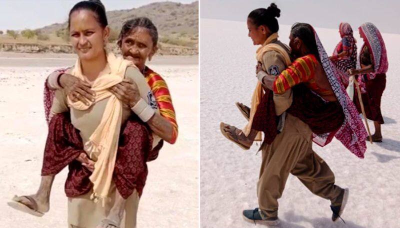 Woman cop carries elderly woman on shoulders for 5 kms in Kutch desert; wins netizens' hearts-tgy