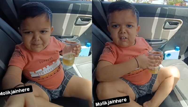 child asks father to stop taking videos of him while eating